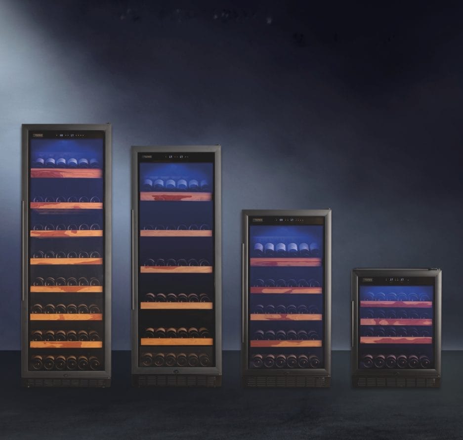 Four wine coolers of different sizes, each filled with bottles, displayed against a blue, misty background with subtle lighting.